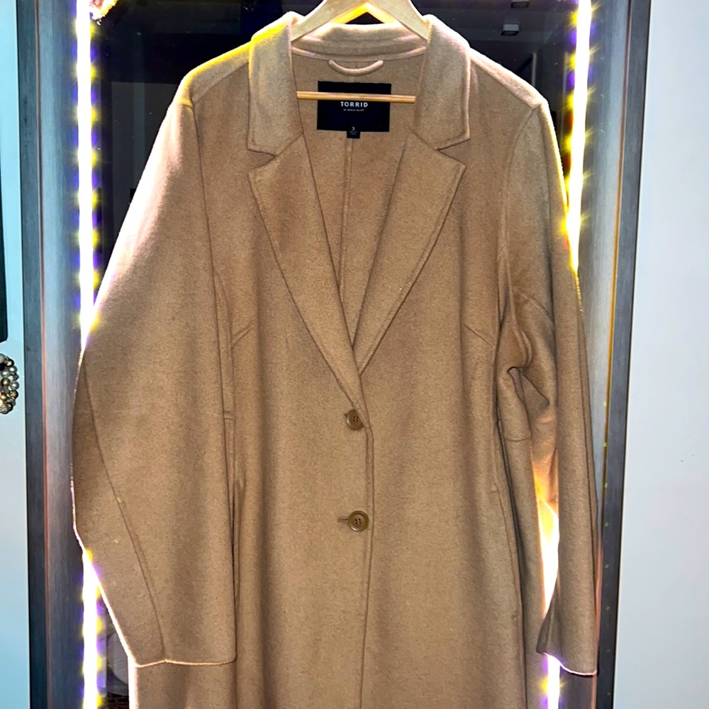 A classic light camel colored mid-weight, duster coat.